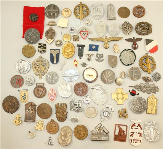 A large collection of various German Third Reich badges,